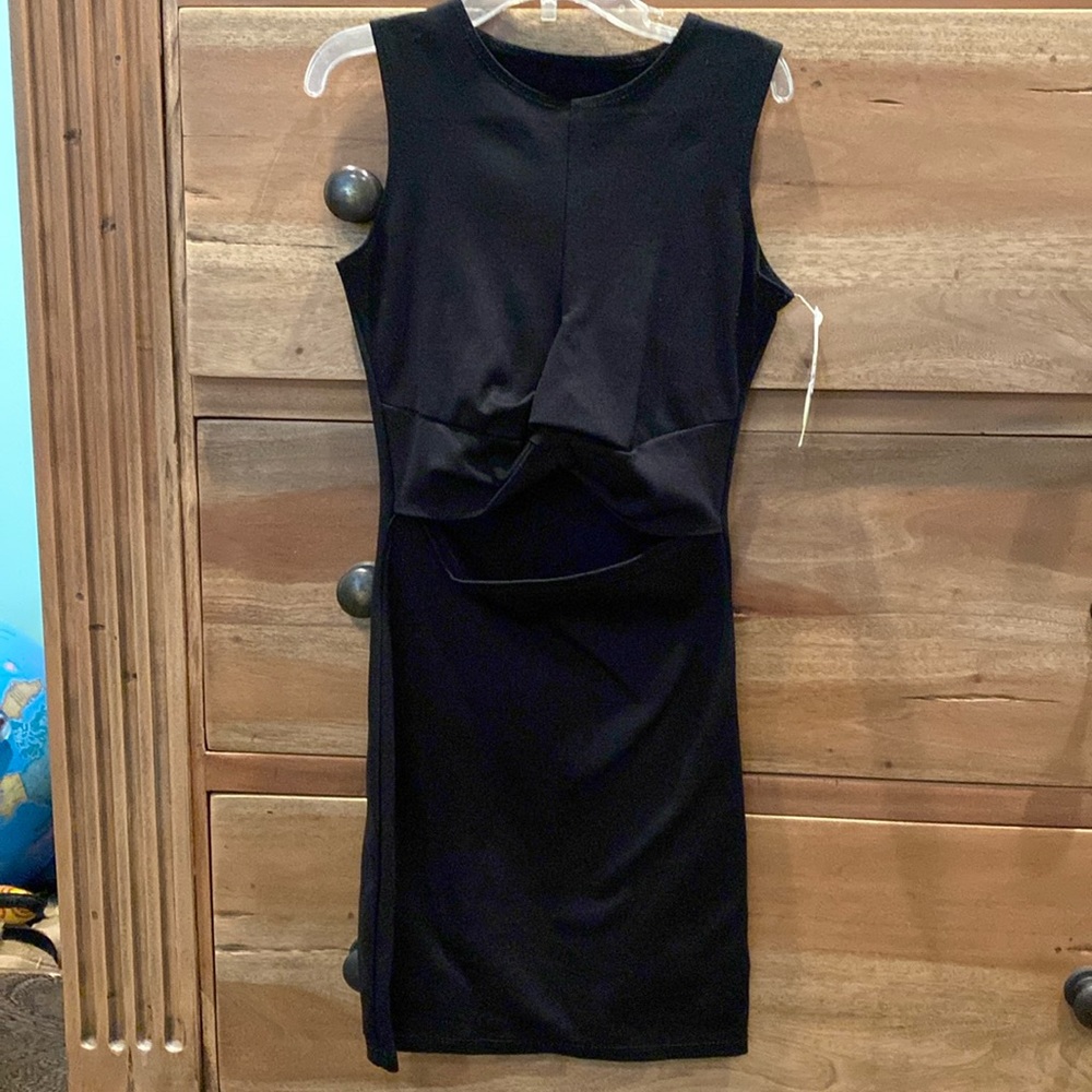 Black gils dress.  Knot at waste with a mid-drift opening.